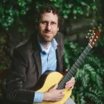 Portrait of Adam Frank with Guitar
